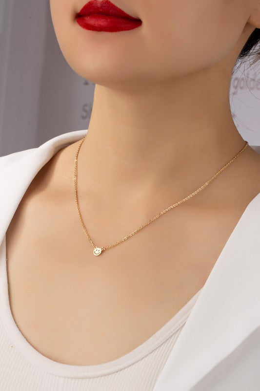 mini smiley face on a delicate chain necklace