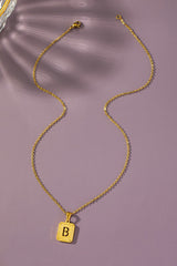 Brass diamond dust cut out initial necklace